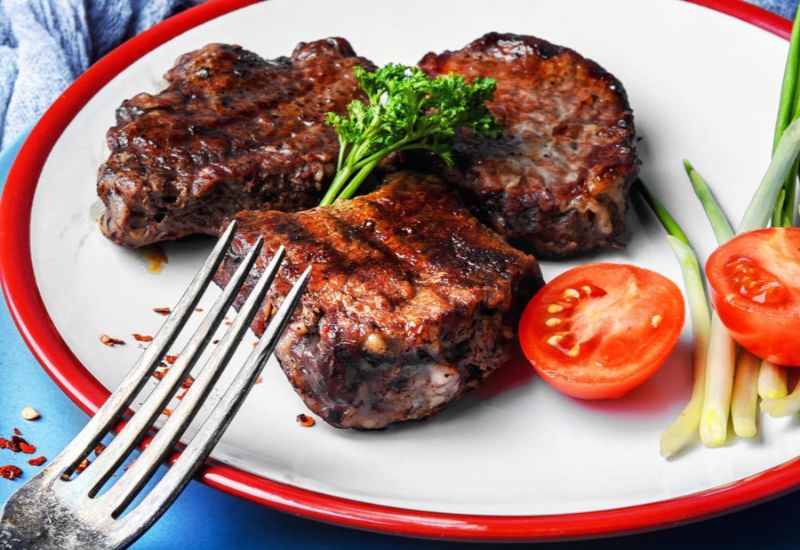 Juicy veal steaks on a plate