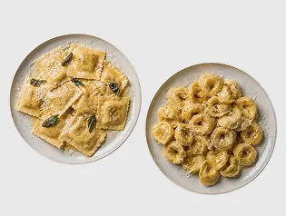Two plates of ravioli and tortellini pasta dishes